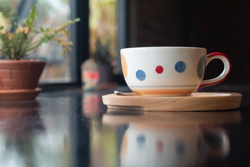 A cup of Latte coffee on wooden desk, Relaxing time or coffee's break time during work day