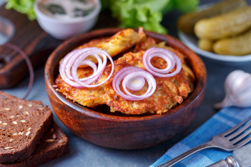 Draniki - potato fritters. potato pancakes lie on a plate. The national dish of Belarus, Ukraine, Russia.