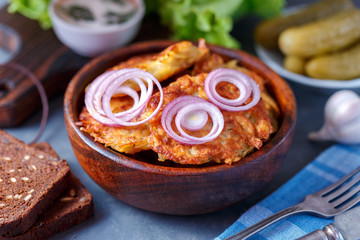 Draniki - potato fritters. potato pancakes lie on a plate. The national dish of Belarus, Ukraine, Russia.