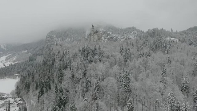 Aerial View Of Neuschwanstein getting altitude while flying towards to the castle