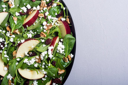 Autumn Spinach Salad With Apple , Cheese , Walnut And Dried Cranberry . Healthy Vegetarian Food