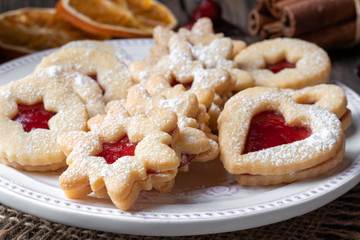 Traditional Linzer Christmas cookies arranged on a plate