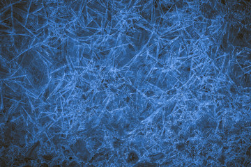 Fototapeta premium A lot of sharp blue icicles as a background or backdrop. Dark blue image