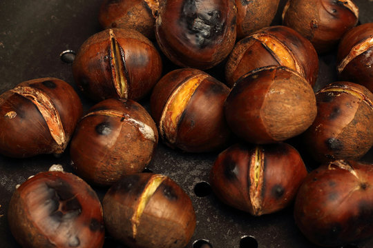 Roasted Chestnuts on a drilled Skillet, closeup view