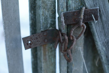 Lock and fence in winter