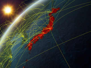 Japan on model of planet Earth with network and international networks. Concept of digital communication and technology.