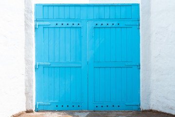 Closed blue door with frame Isolated