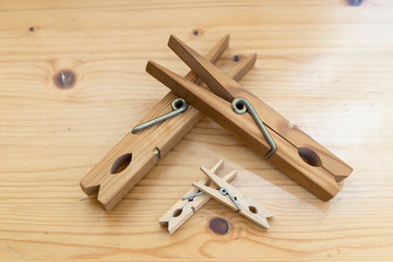 wooden clothespins of giant size and other two small