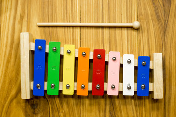 Children's metallophone on a wooden table