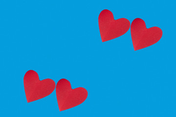 background for Valentine's day holiday, heart on blue background, couple of hearts on red and blue background