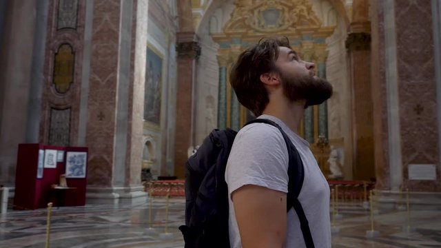 Young Male Tourist in Awe of Stunning Cathedral in Rome.