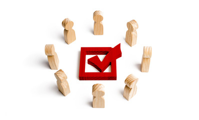 People stand in a circle and look at the red check mark in the box. election, poll or referendum. Poll people. Voters participate in elections of parliament or president, teamwork. Selective focus