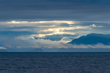 cloudy sunrise in the south pacific, sailing through the Corcovado Gulf