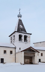 Bell tower of ancient russian monastery in winter time