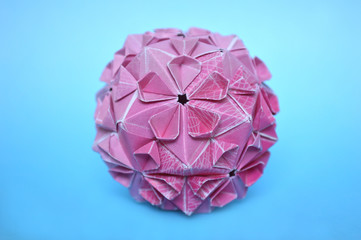 Modular origami, cherry blossom, on blue background