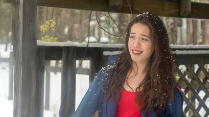 Young asian teen standing in snow