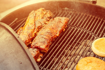 Cooking delicious pork meat steak ribs on a grill