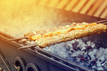 Cooking Kebab on metal skewer barbecue. Traditional Turkish cuisine