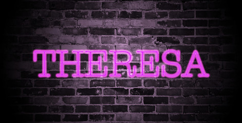Obraz premium first name Theresa in pink neon on brick wall