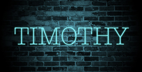 first name Timothy in blue neon on brick wall