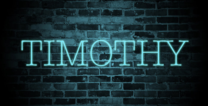 first name Timothy in blue neon on brick wall