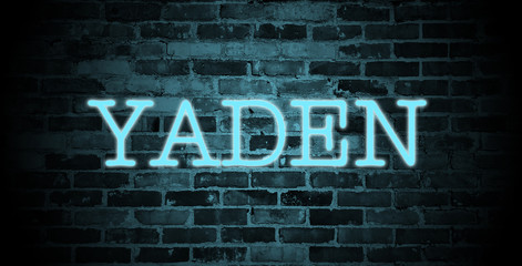 Obraz premium first name Yaden in blue neon on brick wall