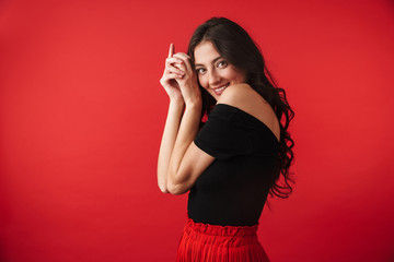 Pretty young woman wearing a dress standing