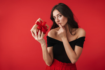 Pensive young woman wearing a dress