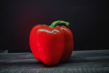 red pepper on wooden background