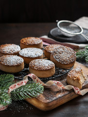 Traditional Christmas cookies with almonds and sesame on dark wooden background