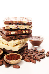 Chocolate bars on table with chocolate tower.