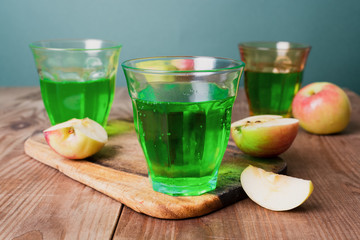 green apple soda on wooden table