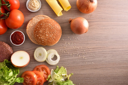 Ingredients for preparation of a homemade burger on kitchen bench
