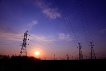 electric tower in the setting sun