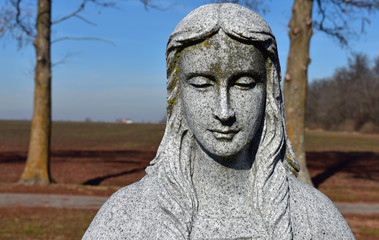 Fototapeta na wymiar Stone cemetery statue