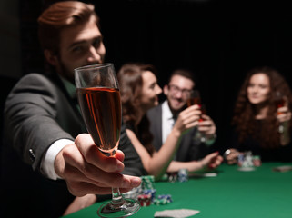 poker player with a glass of wine
