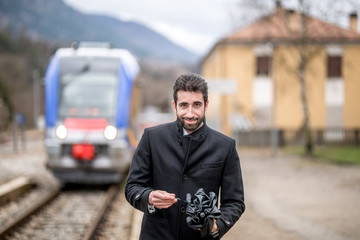 Portrait of an businessman at a train station