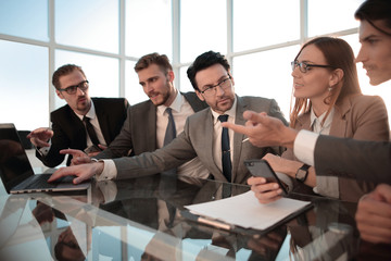 Colleagues in discussion in traders office.