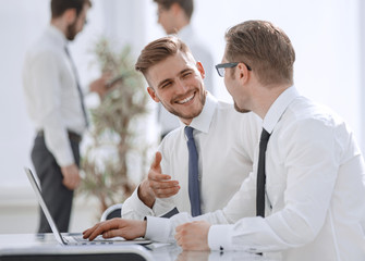 two employees talking in the workplace
