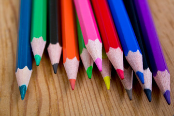 color pencils isolated on wooden background