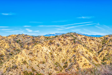 Rugged hiking landscape with mountains and blue sky