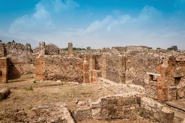 Fototapeta na wymiar Pompeii ruins: remains of ancient houses at archaeological site