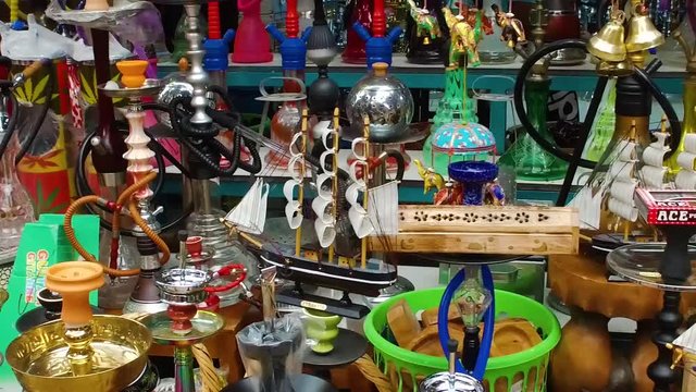 Pan shot of lot of hookahs market. showcase of Many hookahs exhibition smoke goods, tools for tobacco smoking and blowing smoke, hookah smoking, addiction and a way to relax