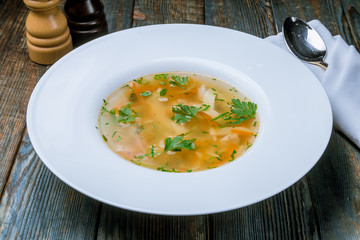 Chicken soup bouillon in a plate