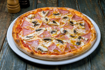 Pizza with ham and mushrooms
