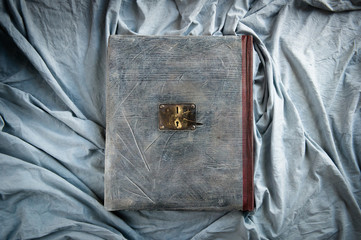 An antique book with a metal clasp