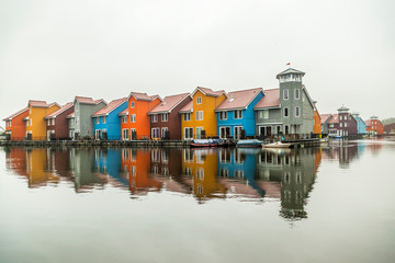 Fototapeta na wymiar multicolored houses on lake