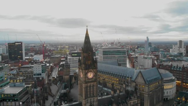 4K Drone aerial shot flying over Manchester  Christmas Markets during the early cold mornings Albert Square Town Hall and above Zippy Santa Claus Statue
