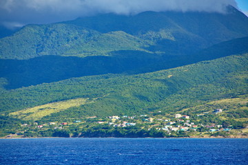 Fototapeta na wymiar Houses on Green Hills of St Kitts