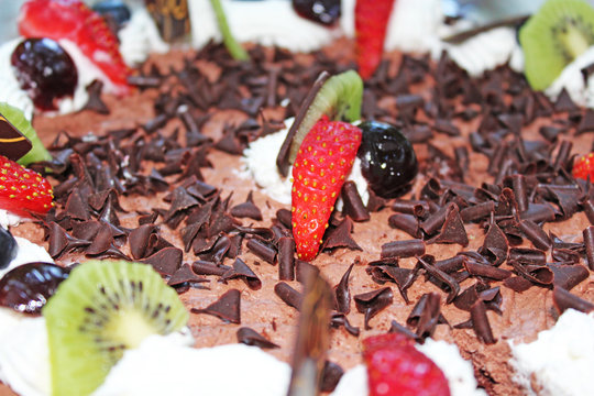 Birthday chocolate cake with strawberry decoration